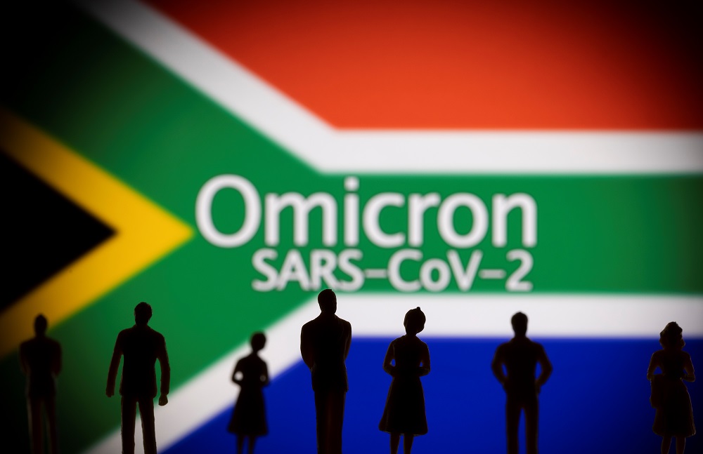 A preliminary study by South African scientists published Thursday suggests the Omicron variant is three times more likely to cause reinfections. — Reuters pic