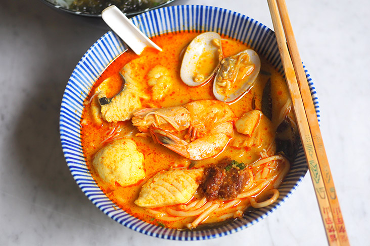 The menu includes various noodles like this seafood curry noodles that has a mild curry taste