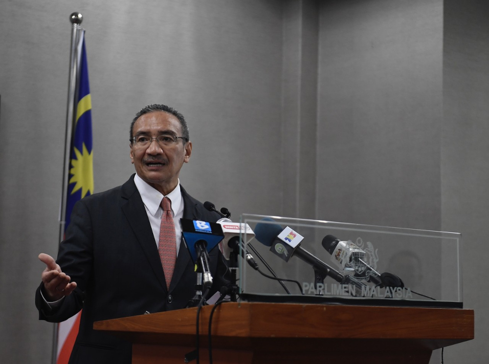 Senior Defence Minister Datuk Seri Hishammuddin Hussein speaks at a press conference in Parliament building, November 30, 2021. — Bernama pic