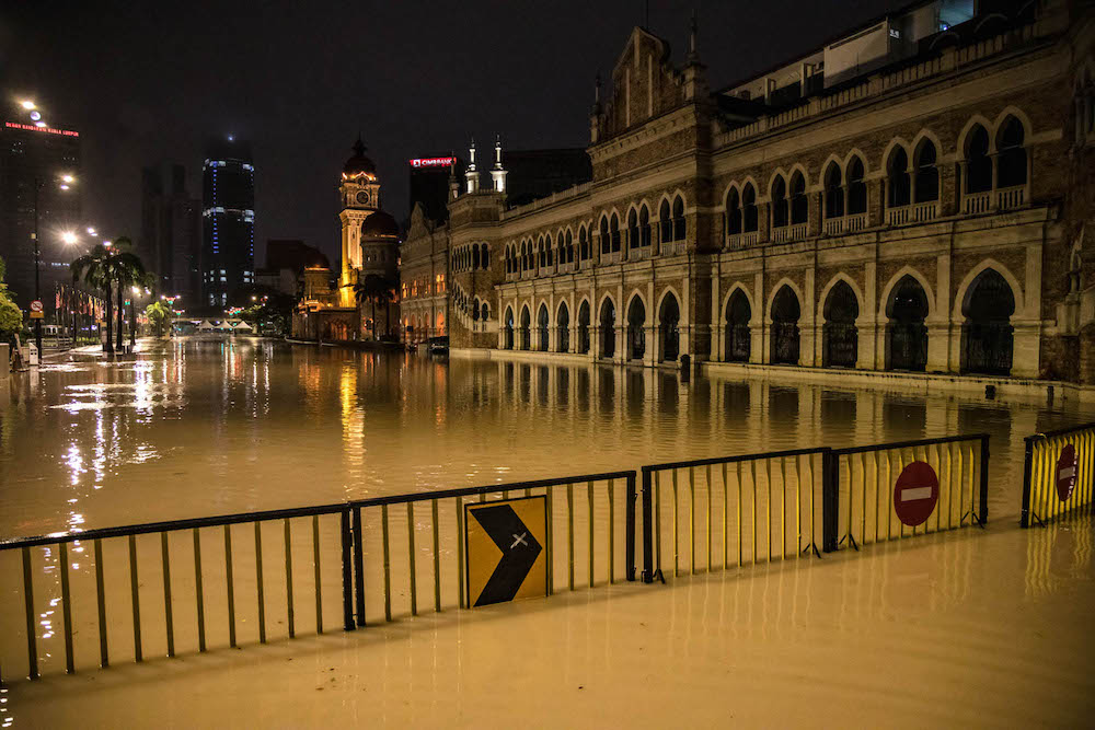 The area around Dataran Merdeka in Kuala Lumpur is submerged in floodwaters amid incessant rain December 19, 2021. — Picture by Firdaus Latif