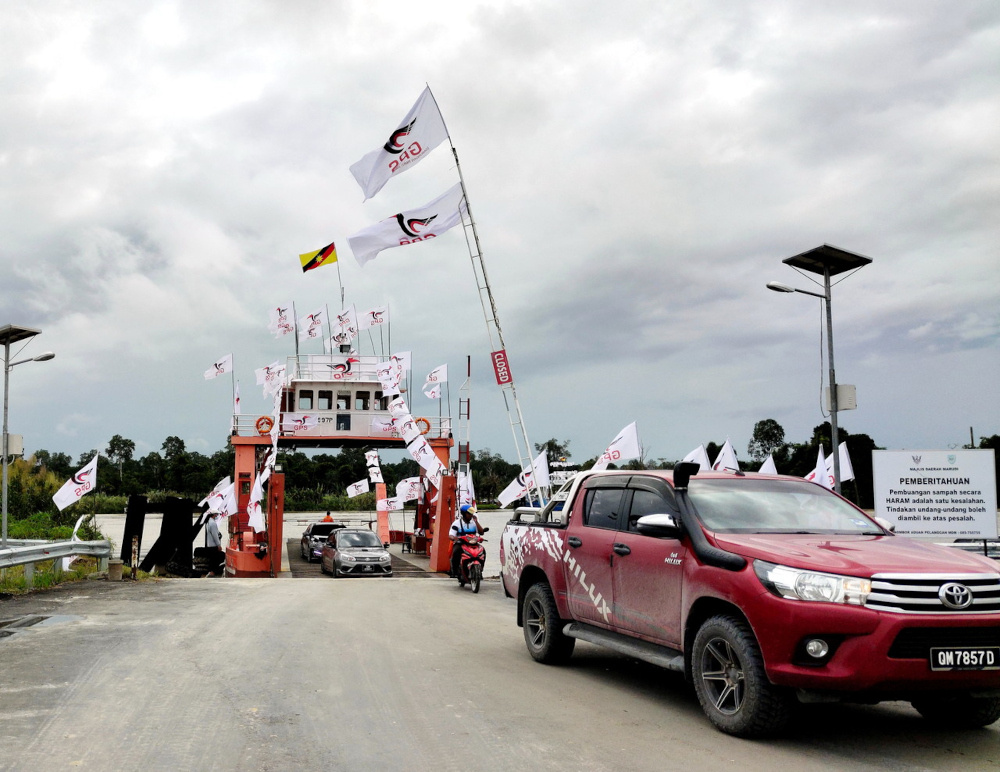 Party flags seen at the Marudi ferry jetty at Sungai Bakong, next to the Iban Sg Arang ethnic village, a major thoroughfare between the town of Marudi and Miri and Bintulu, Sarawak, December 2, 2021. — Bernama pic