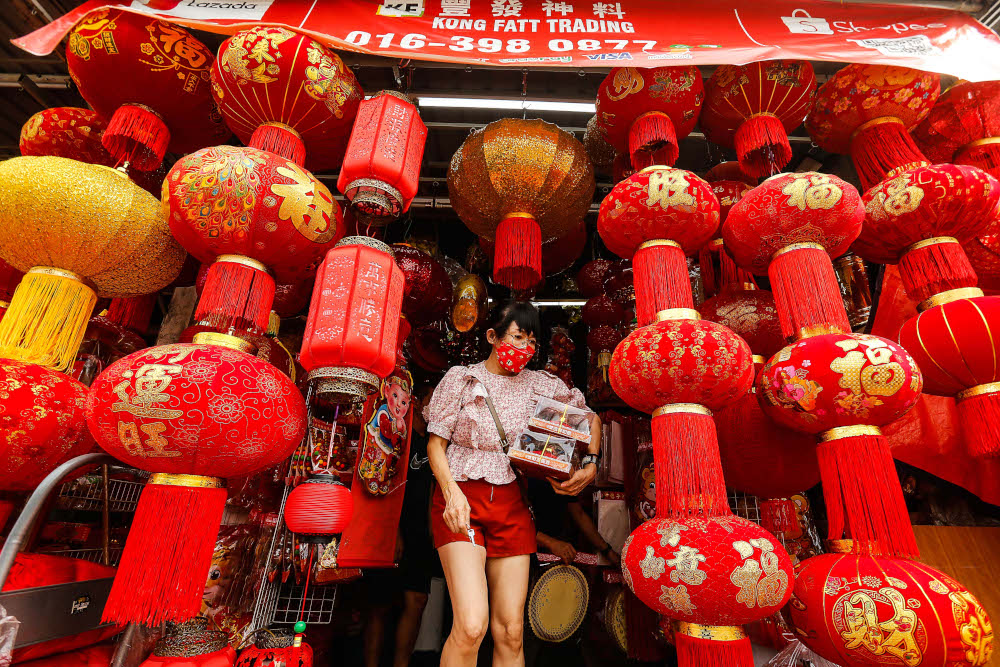 A customer looks at lanterns in preparation for the upcoming Chinese New Year celebration at Lebuh Carnavon in Penang January 24, 2022. — Picture by Sayuti Zainudin