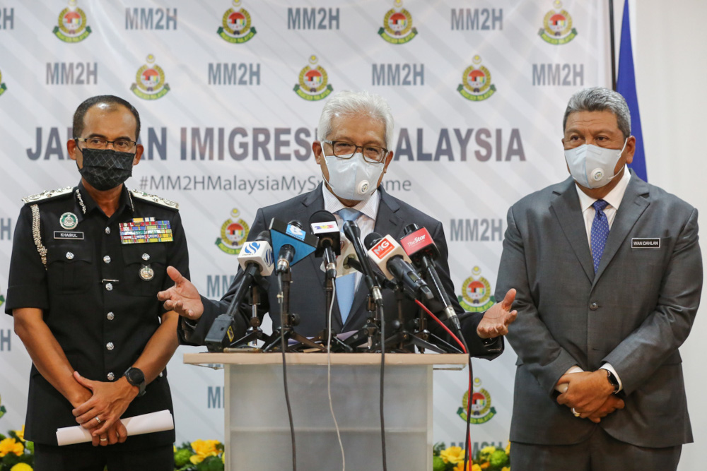 Home Minister Datuk Seri Hamzah Zainudin speaks during a press conference at the Malaysian Immigration Department headquarters in Putrajaya, January 21, 2022.