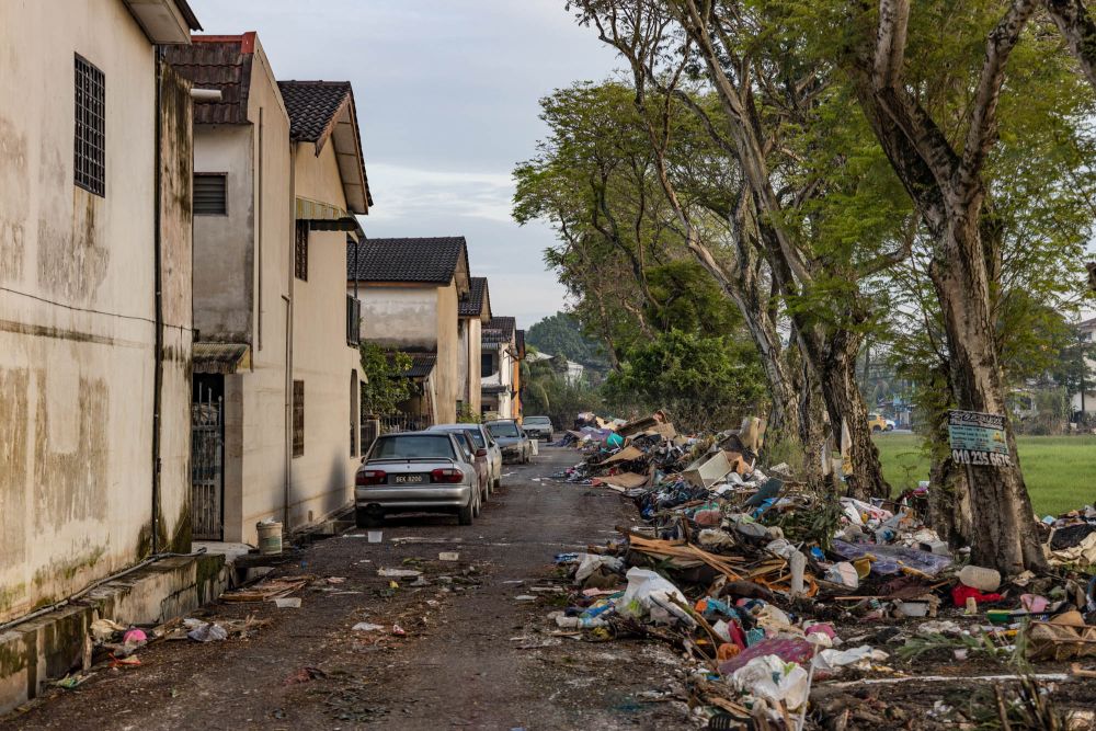 Piles of rubbish and debris are seen lining the streets of Taman Sri Muda following the flood disaster in Shah Alam January 4, 2022. — Picture by Yusof Mat Isa