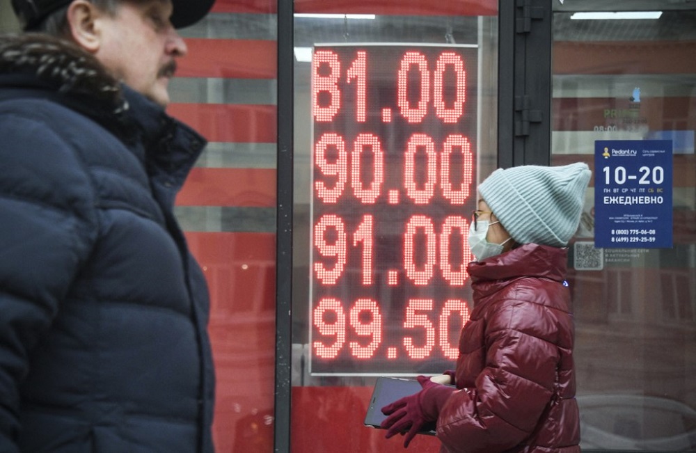 People walk past a currency exchange office in central Moscow on February 24, 2022. u00e2u20acu201d AFP pic