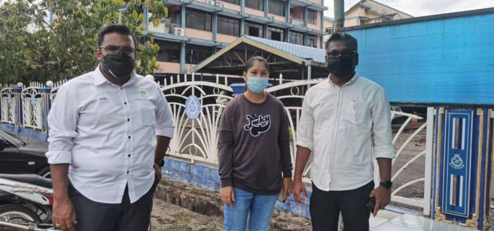 Satees Muniandy (left) and David Marshel with Loh Siew Hong outside the Kangar district police headquarters, February 14, 2022. u00e2u20acu201d Picture courtesy of Satees Muniandynn