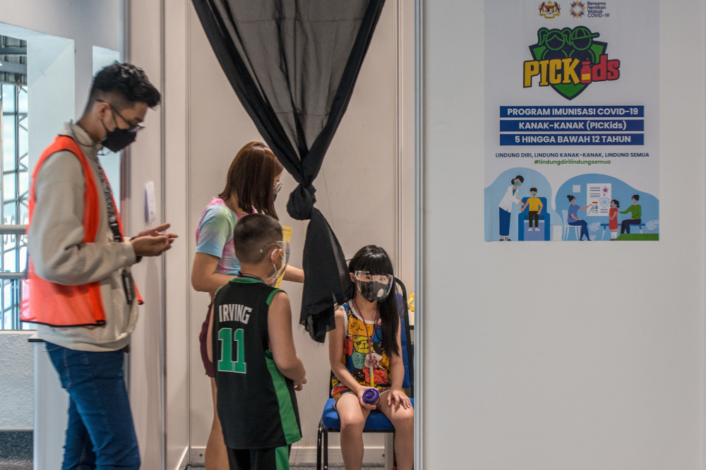 Children between the ages of five and 12 get their Covid-19 vaccine during the National Covid-19 Immunisation Programme for Kids (PICKids) at Axiata Arena in Bukit Jalil, February 3, 2022. u00e2u20acu201d Picture by Shafwan Zaidon