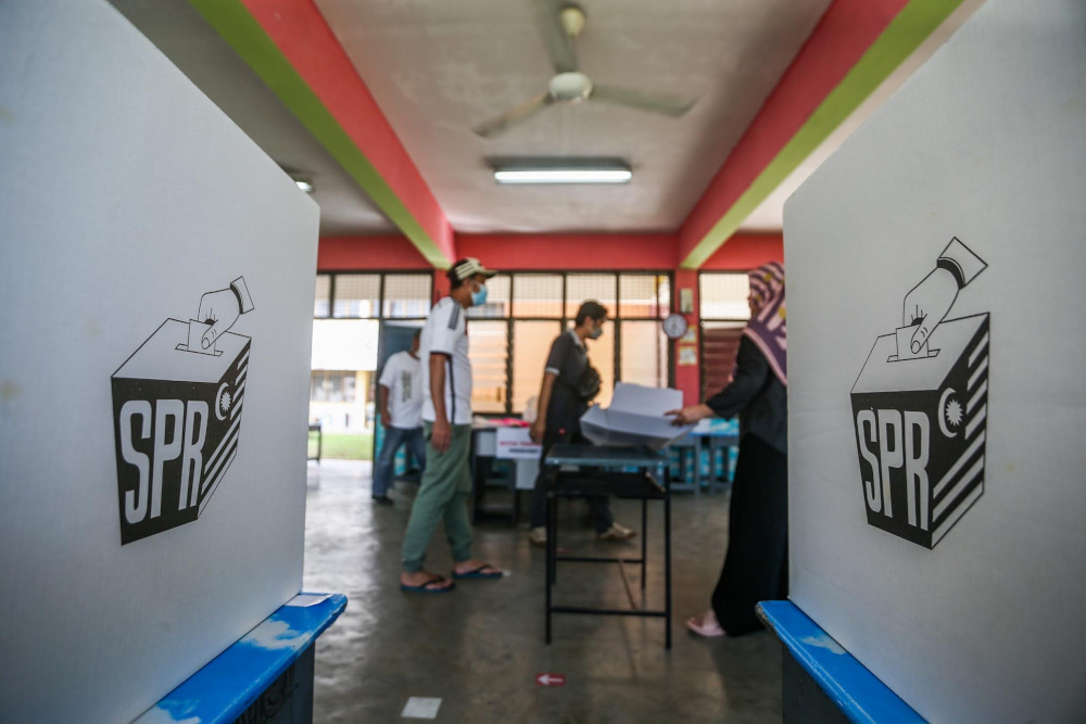 Election Commission officers make final preparations for the voting process in conjunction with the Johor state election at Sekolah Kebangsaan Tanjung Puteri, Johor Baru, March 11, 2022. u00e2u20acu201d Picture by Hari Anggara