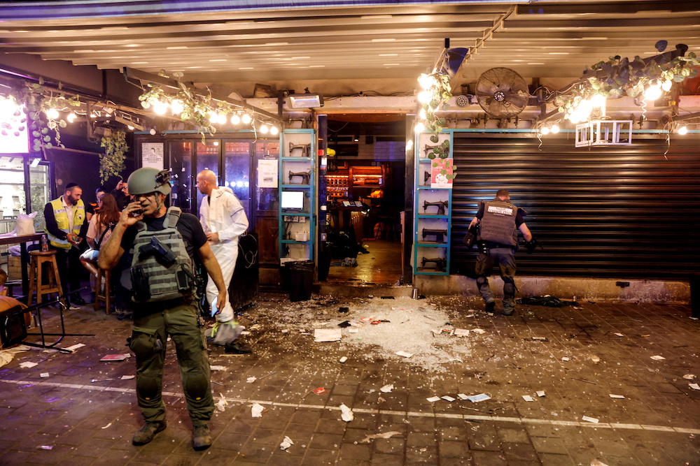 Israeli security and rescue personnel work by the entrance to a restaurant following an incident in Tel Aviv, Israel April 7, 2022. u00e2u20acu201d Reuters/Moti Milrod pic