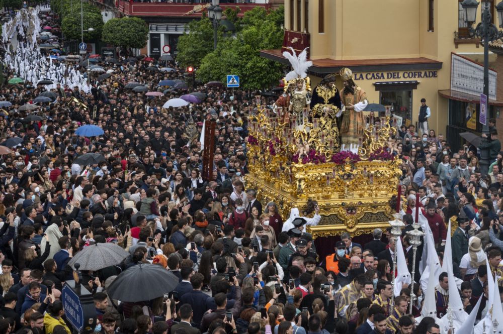 Penitents march during a procession as they carry the image of Jesus Christ in celebration of the Holy Monday, Seville, Spain, Apr 11, 2022. u00e2u20acu201d SOPA Images/Sipa USA via Reuters