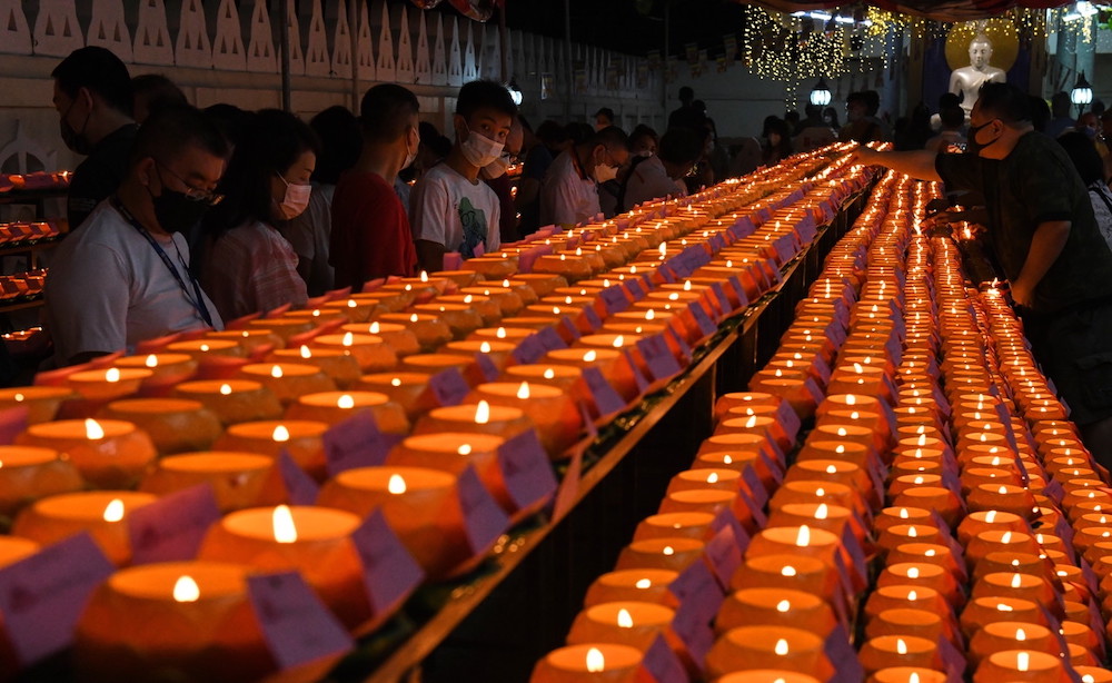 Candles light up the Mahindrama Buddhist temple as Buddhists celebrate Wesak Day, George Town May 14, 2022. — Bernama pic