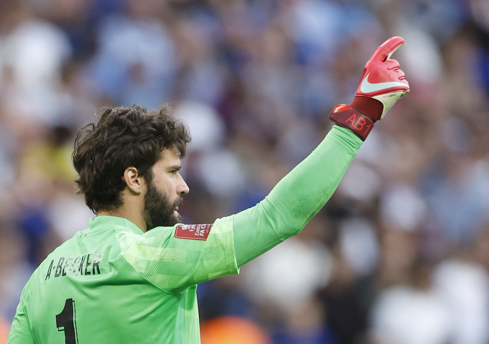 Liverpool's Alisson reacts after saving Chelsea's Mason Mount penalty during the shoot-out of the final of the FA Cup, London May 15, 2022. — Action Images via Reuters/Peter Cziborra