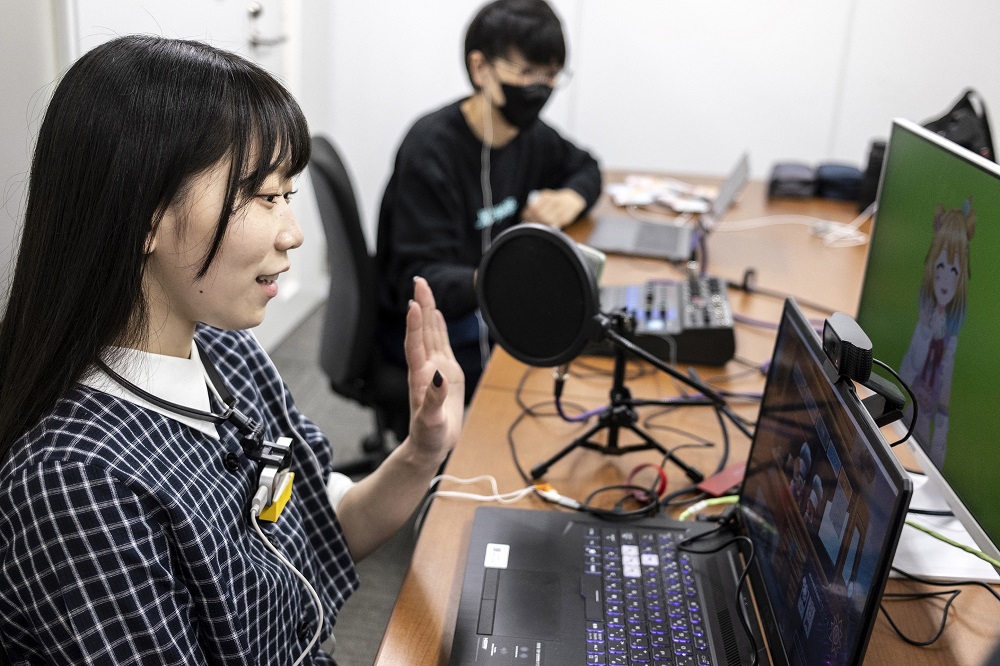 Mayu Iizuka, a virtual YouTuber who voices and animates a character called Yume Kotobuki, hosting a livestream at a studio in Tokyo. u00e2u20acu201d AFP pic