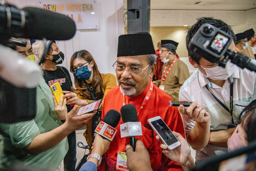 Umno supreme council member Datuk Seri Tajuddin Abdul Rahman speaks to reporters at Umnou00e2u20acu2122s extraordinary general meeting (EGM) at the World Trade Centre in Kuala Lumpur May 15, 2022. u00e2u20acu201d Picture by Firdaus Latif