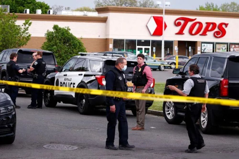 Police officers secure the scene after a shooting at TOPS supermarket in Buffalo, New York, US, May 14, 2022. — Reuters pic