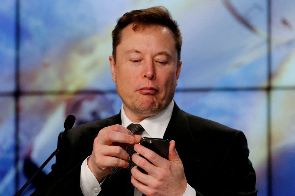 Elon Musk looks at his mobile phone in Cape Canaveral, Florida January 19, 2020. — Reuters pic