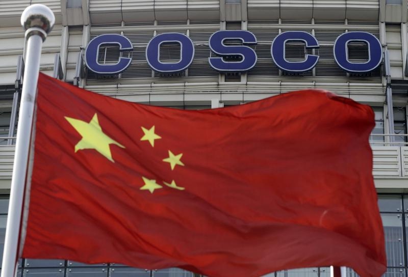 A Chinese national flag flies in front of COSCO's headquarters in Beijing August 26, 2010. u00e2u20acu201d Reuters pic