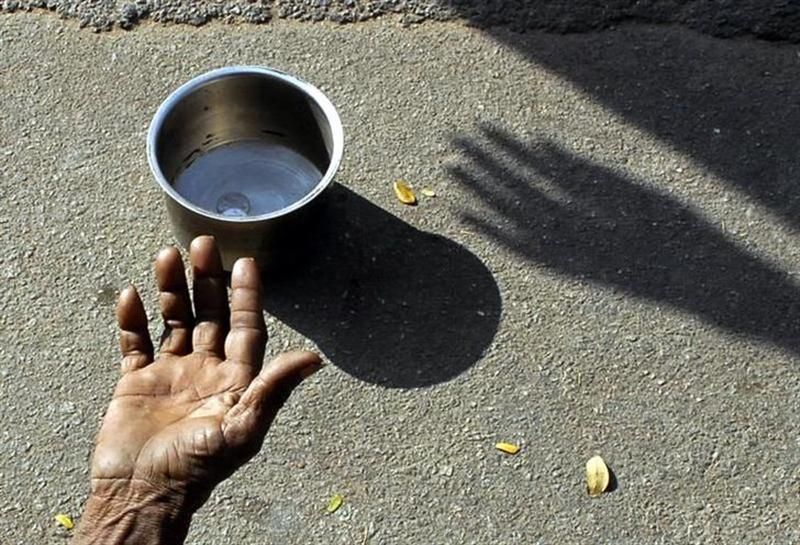 A beggar extends his hand for money at a street in Hyderabad. u00e2u20acu201d Reuters pic