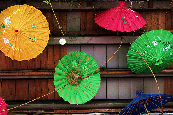 Rainbow-hued Chinese parasols dangle from the ceiling