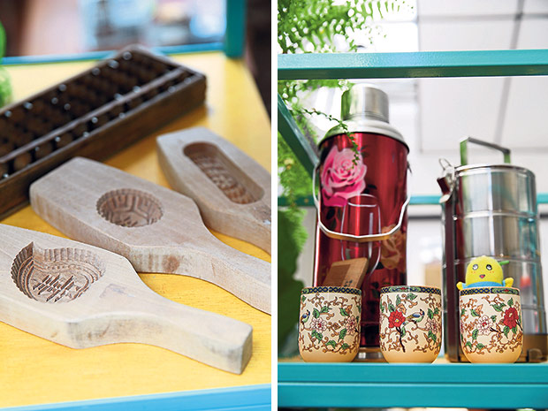 An abacus and ang koo kueh moulds (left). Tiffin carriers, old school thermos flasks and decorated china cups (right).