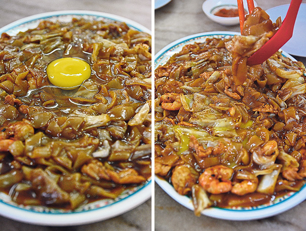 Moonlight Kuey Teow, characterised by the “moon” on top; a raw egg cracked atop the pile of piping hot noodles (left). Then, you give the noodles a good stir; the runny egg yolk coating the kuey teow makes for a wet and savoury sensation (right).