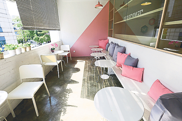 The outdoor seating area looks out onto the busy commercial square of Sri Petaling