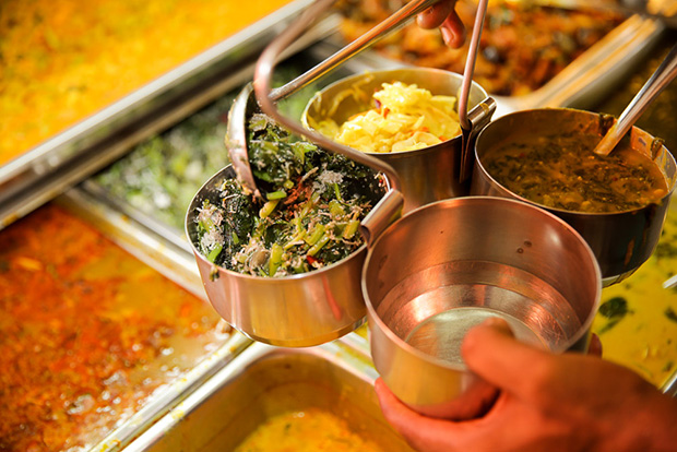 Vegetables are placed in containers to be brought to tables.