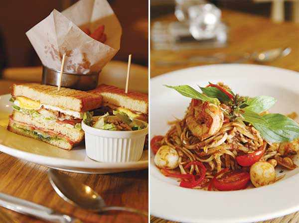 The Delicious Club Sandwich is a tasty combination of freshly baked brioche, grilled chicken, turkey bacon, egg, tomatoes and homemade pesto (left). One can’t get enough of the aromatic and lightly spicy Dry Tossed Sambal Linguine with fishballs, calamari and tiger prawns (right)