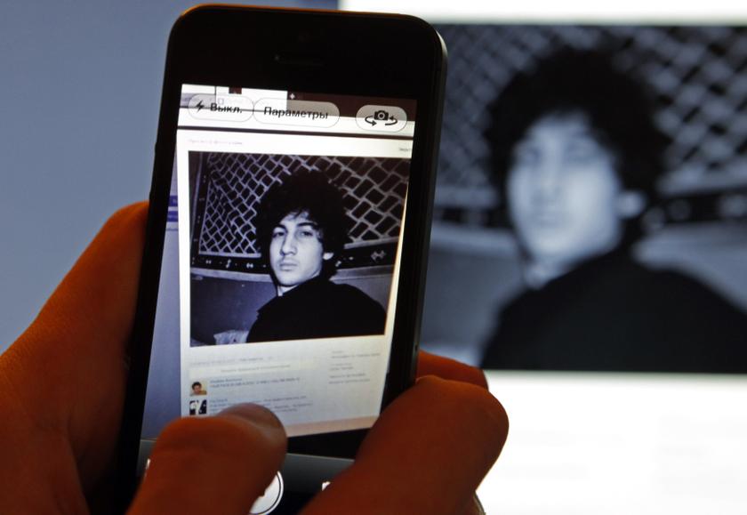A photograph of Dzhokhar Tsarnaev, a suspect in the Boston Marathon bombing, is seen on his page of Russian social networking site Vkontakte (VK), as pictured on a monitor and a mobile phone in St. Petersburg in this April 19, 2013, file photo. u00e2u20acu201d Reuter