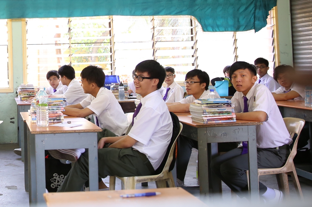 Students getting ready during their first day of school in Sekolah Menengah Kebangsaan (SMK) St Gabriel, Kampung Pandan, January 2, 2014. u00e2u20acu201d Picture by Saw Siow Feng
