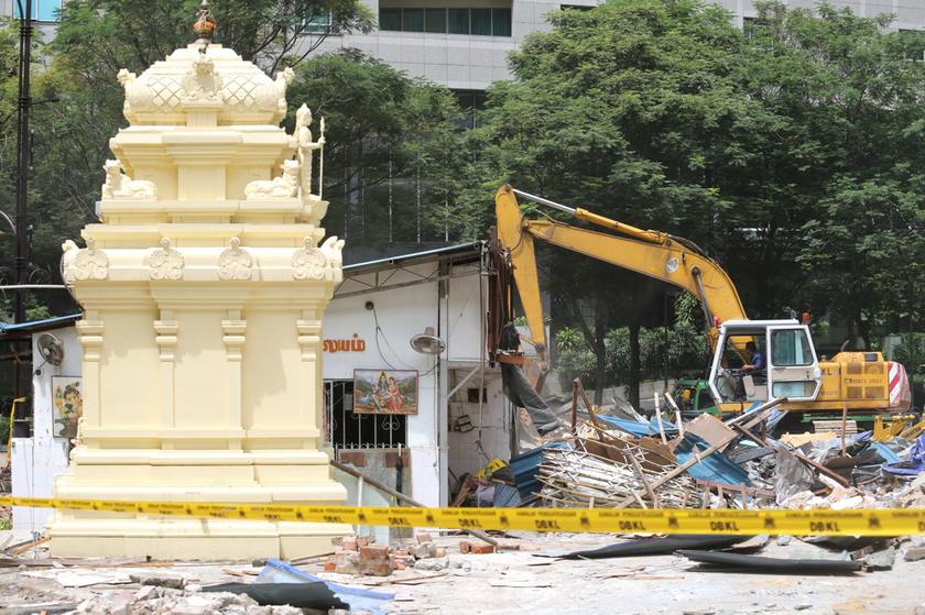 Debris and excavators are visible next to the shrine of the Golden Triangle Muneswarar Kuil in Kuala Lumpur, November 10, 2013. — Picture by Choo Choy May
