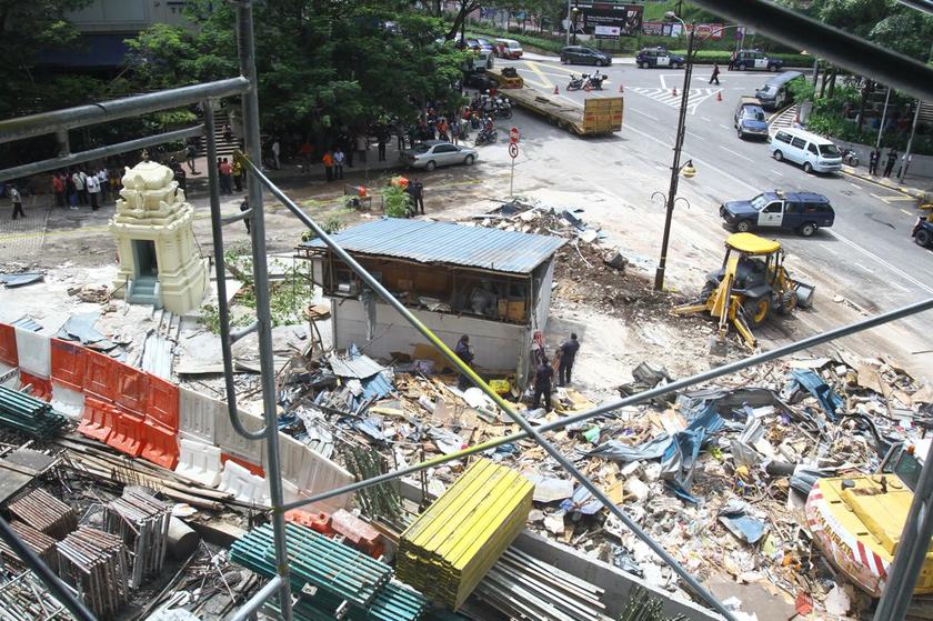 An aerial view of the rubble around the main temple being cleared. — Picture by Choo Choy May