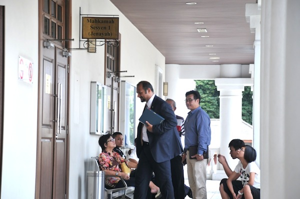 Members of Lim Chin Aiku00e2u20acu2122s family wait outside the courtroom during the inquest into his death in George Town, September 2, 2013. u00e2u20acu201d  Picture by K.E. Ooi