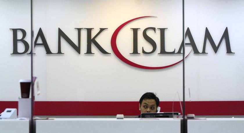 A bank staff speaks on the phone inside the Bank Islam branch office in Shah Alam November 13, 2013.&nbsp;—&nbsp;Reuters pic