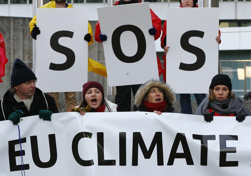 Members of environmental associations hold signs outside the European Commission headquarters during the presentation of the 2030 Framework for Climate and Energy EU2030 in Brussels January 22, 2014. u00e2u20acu201d Reuters pic