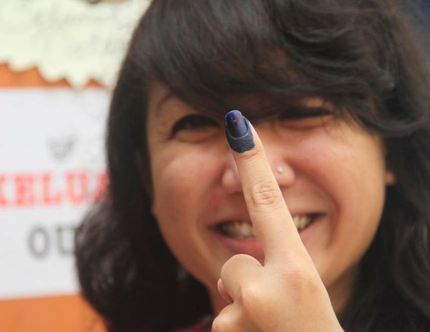 File photo of a voter showing the u00e2u20acu02dcindelible inku00e2u20acu2122 on her finger after casting her ballot in the May general election.