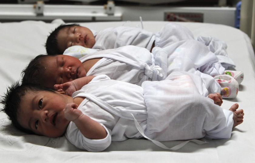 Babies who were born on New Yearu00e2u20acu2122s Day, lie on a bed inside the maternity ward of the Jose Reyes Memorial hospital in Manila January 1, 2014. u00e2u20acu201d Reuters pic