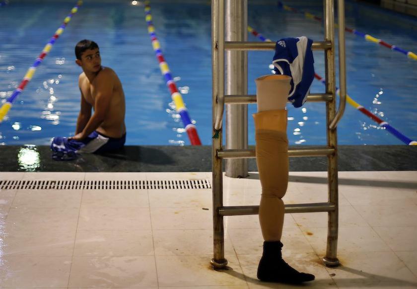 Palestinian Motasim Abu Karsh rests after swimming in a pool during a local competition at al-Sadaka Club in Gaza City November 2, 2013. u00e2u20acu201d Reuters pic