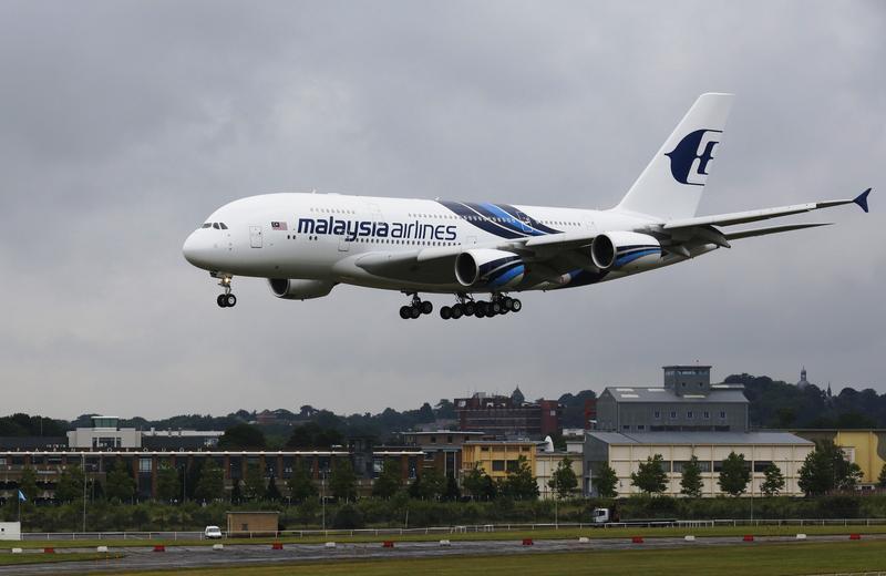 An Airbus A380, owned by Malaysia Airlines, lands ahead of the Farnborough Airshow 2012 in southern England July 8, 2012. u00e2u20acu201d Reuters pic