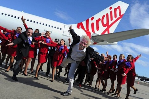 British tycoon Richard Branson (centre) and Virgin Australia CEO, John Borghetti (left) pose beside the new airlineu00e2u20acu2122s Airbus A330-200 at Sydney International Airport on May 4, 2011. u00e2u20acu201d AFP pic